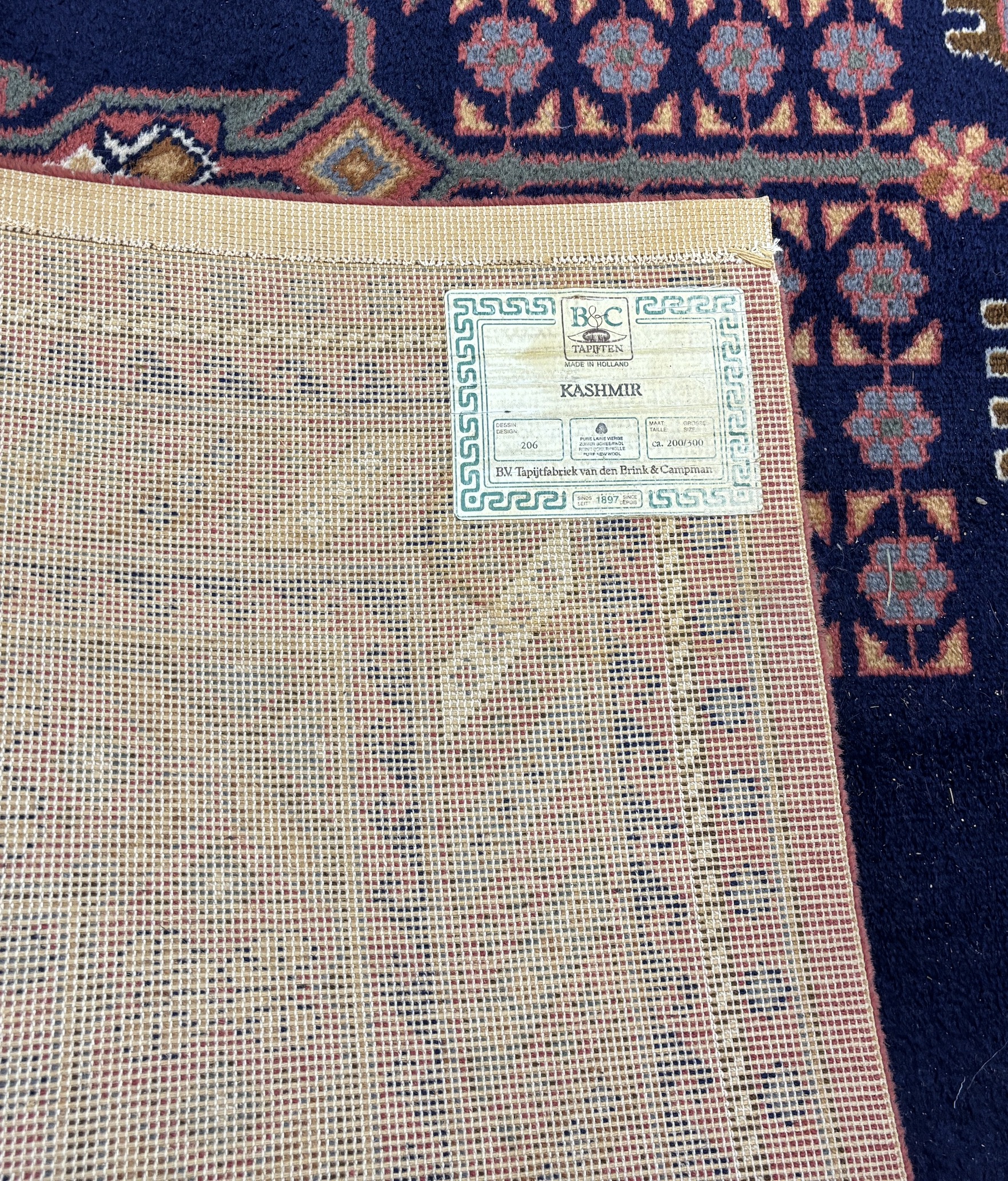 A North West Persian style machined blue ground carpet together with a similar runner, larger 295 x 190cm